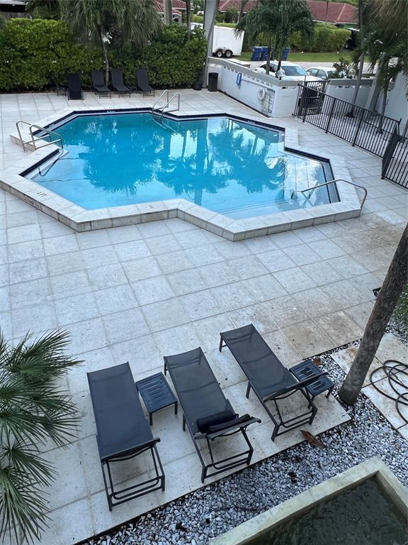 2100 Northeast 33rd Avenue, Unit S A Fort Lauderdale, FL 33305 - Photo 7 of 12 swimming pool view with a sitting space