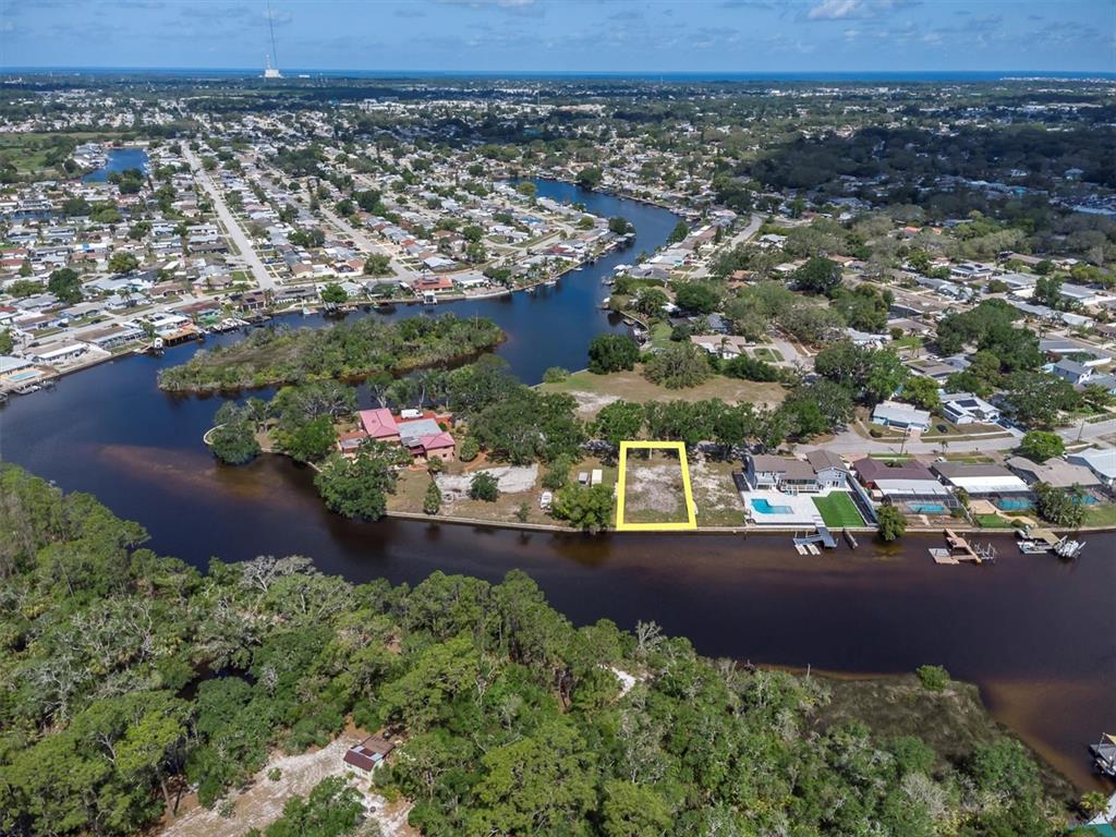 Flotilla Holiday, FL 34690 - Photo 11 of 19 an aerial view of a house with a yard