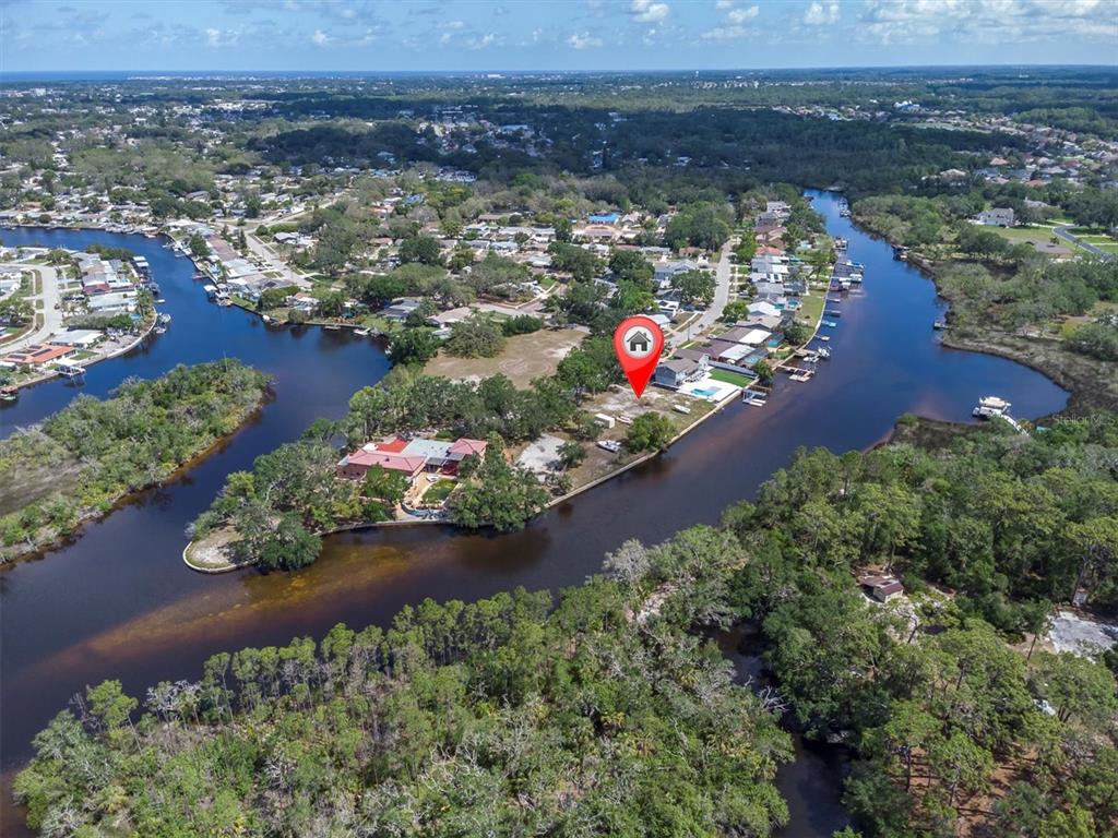 Flotilla Holiday, FL 34690 - Photo 12 of 19 an aerial view of a houses with a lake view