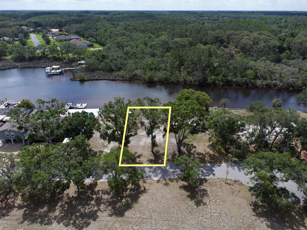 Flotilla Holiday, FL 34690 - Photo 16 of 19 an aerial view of a house with a yard and lake view