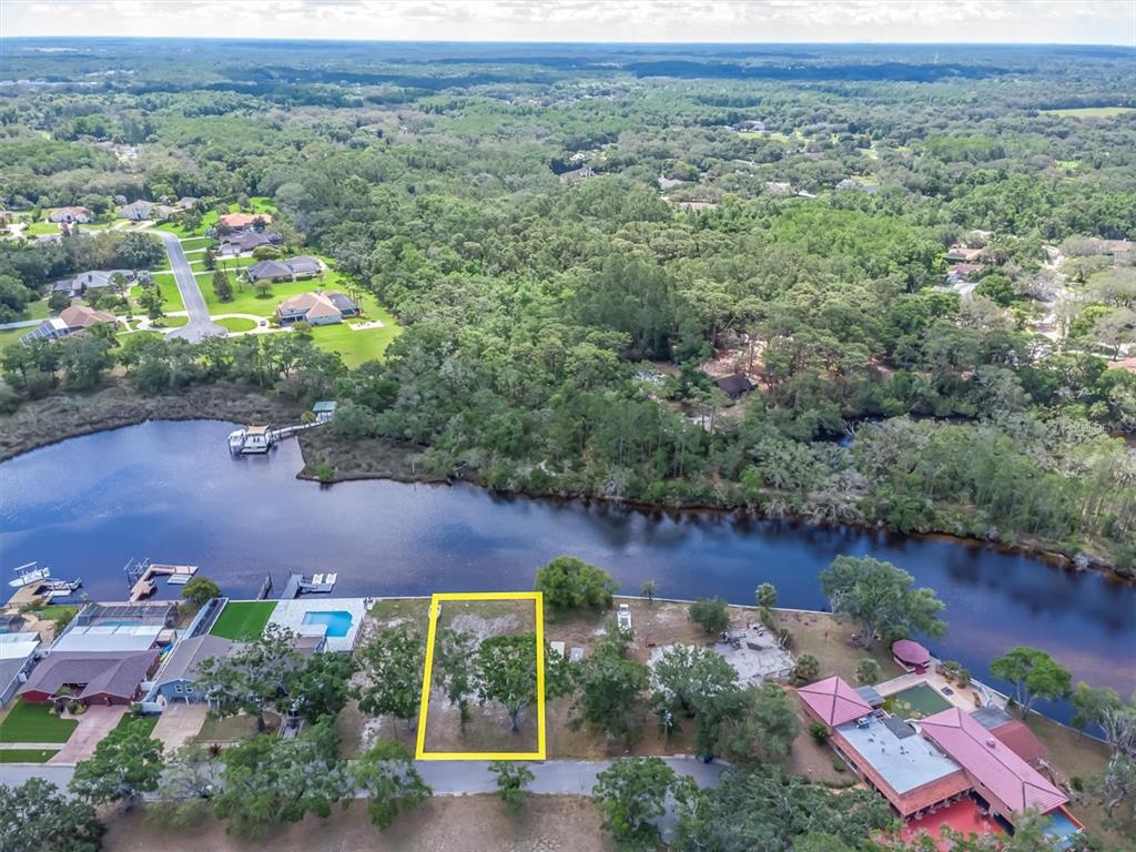 Flotilla Holiday, FL 34690 - Photo 17 of 19 an aerial view of residential house with outdoor space and lake view