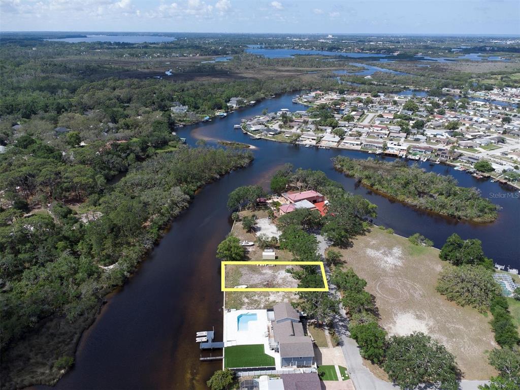 Flotilla Holiday, FL 34690 - Photo 18 of 19 an aerial view of lake and residential houses with outdoor space