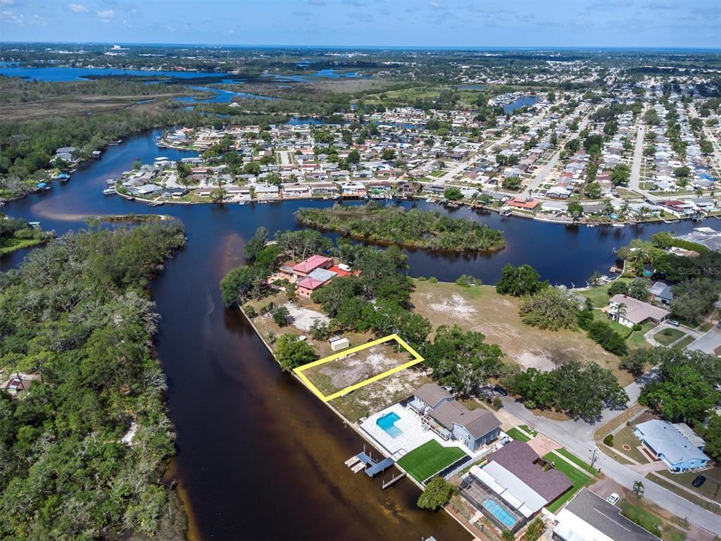 Flotilla Holiday, FL 34690 - Photo 19 of 19 an aerial view of residential houses with outdoor space