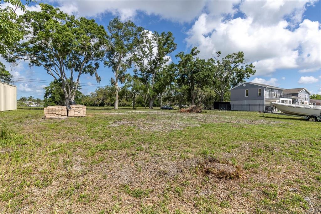 Flotilla Holiday, FL 34690 - Photo 6 of 19 a backyard of a house with lots of green space