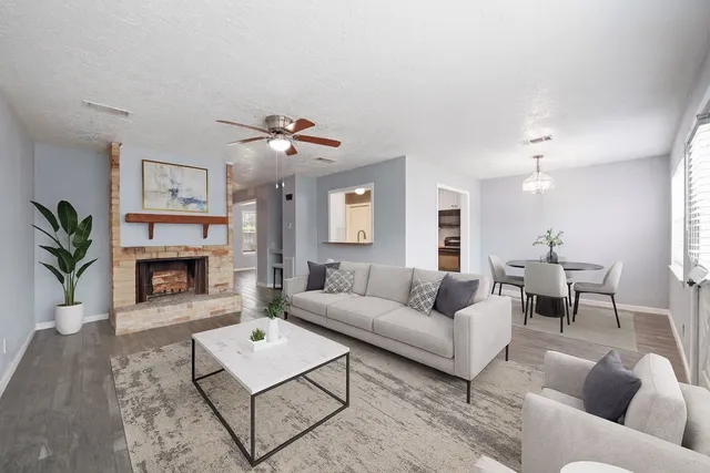 a living room with furniture and a fireplace