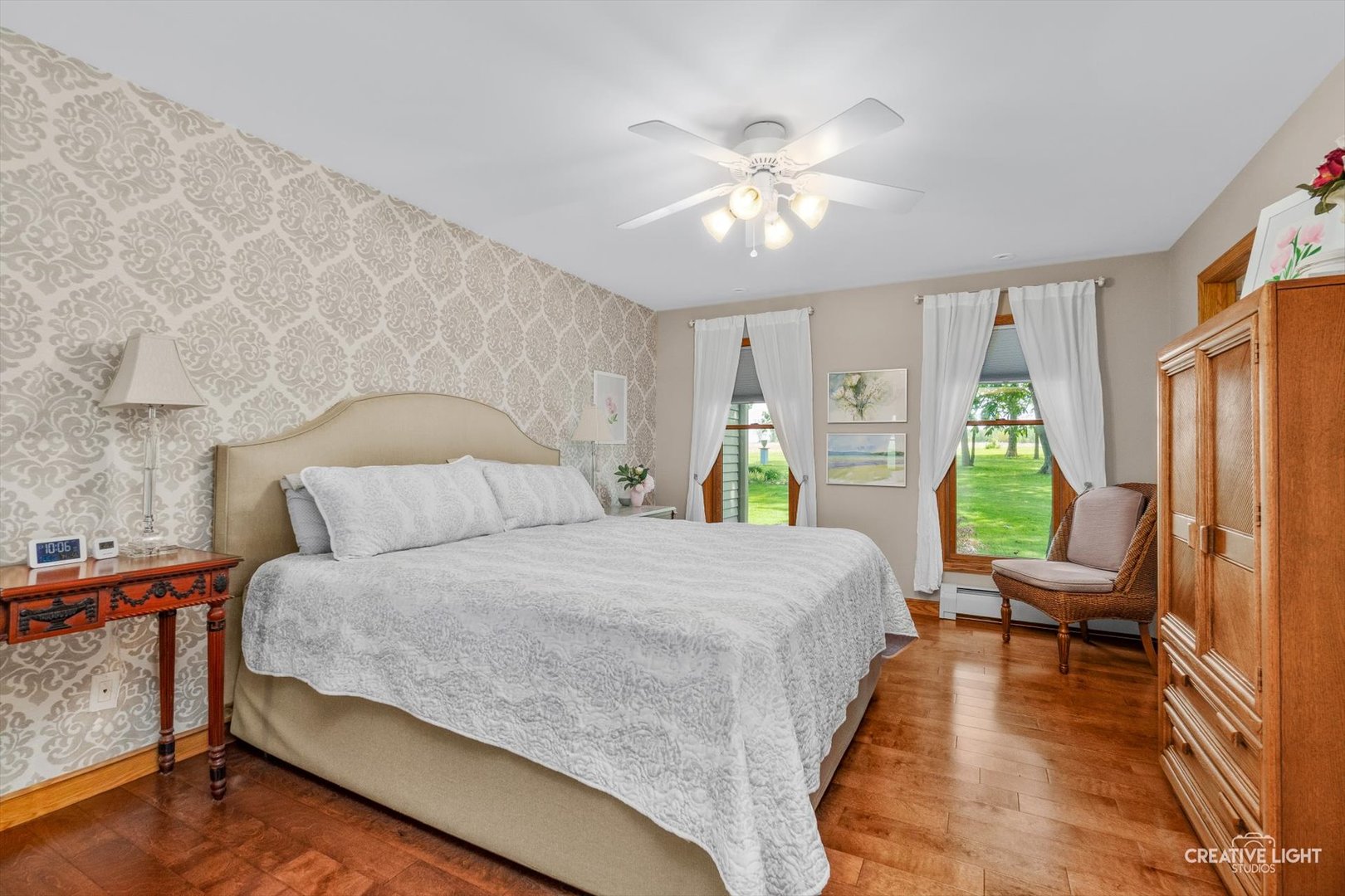 14050 Townhouse Road Newark, IL 60541 - Photo 14 of 45 a bedroom with a bed and a chandelier