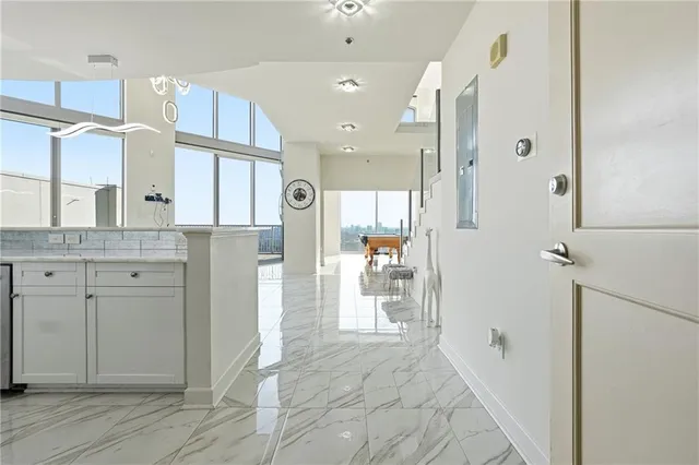 a bathroom with a granite countertop sink mirror and shower