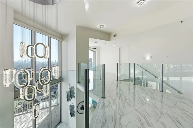 a view of a entryway door with wooden floor