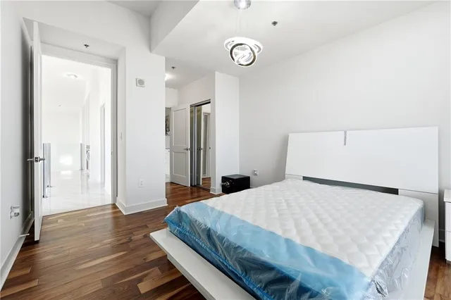 a bathroom with a granite countertop sink a toilet and a bathtub
