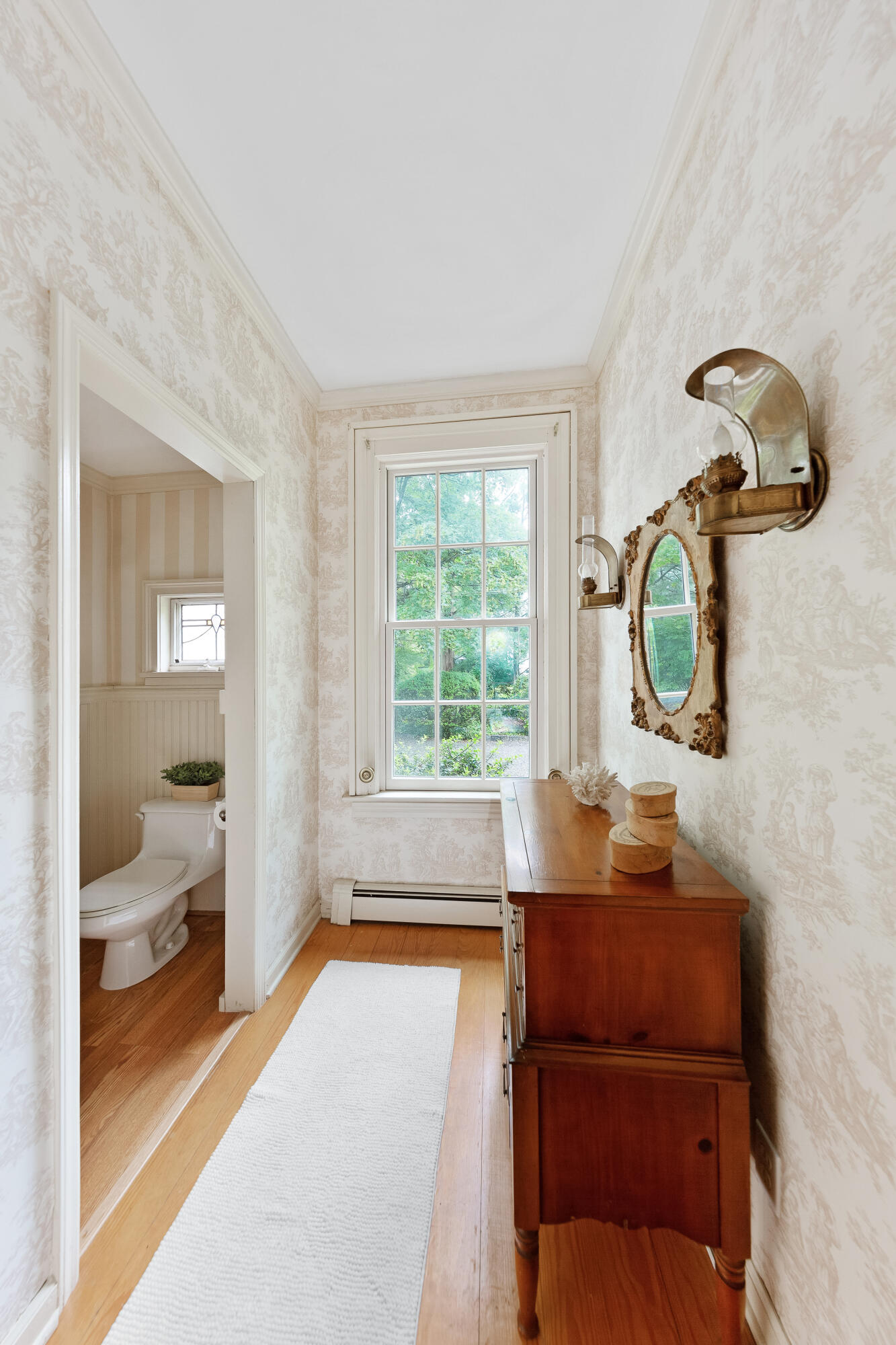 14 Rings End Road Darien, CT 06820 - Photo 19 of 38 a room with a bed and a mirror on dresser