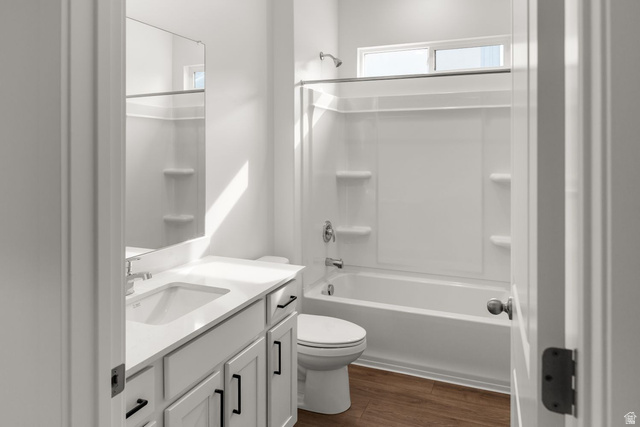 1417 West 2350th South, Unit 14 Perry, UT 84302 - Photo 11 of 19 Bathroom featuring a white vanity with an integrated sink, dark hardware, and a white countertop