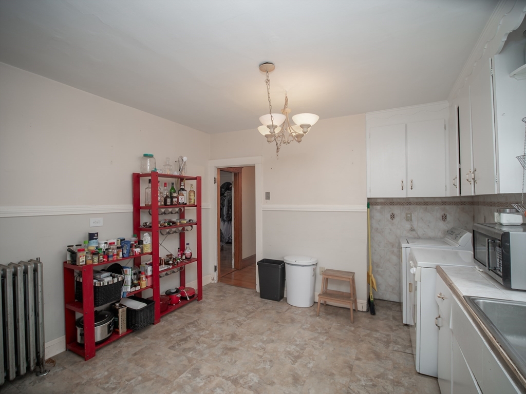 60 Powder House Boulevard, Unit 2 Somerville, MA 02144 - Photo 12 of 42 a view of a storage & utility room with lots of stuff