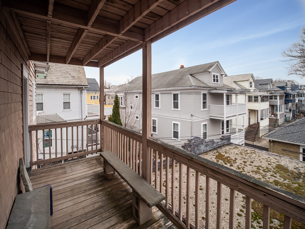 60 Powder House Boulevard, Unit 2 Somerville, MA 02144 - Photo 29 of 42 a view of a house with wooden deck