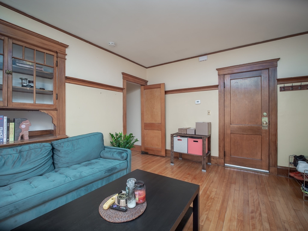 60 Powder House Boulevard, Unit 2 Somerville, MA 02144 - Photo 3 of 42 a living room with furniture and a wooden floor