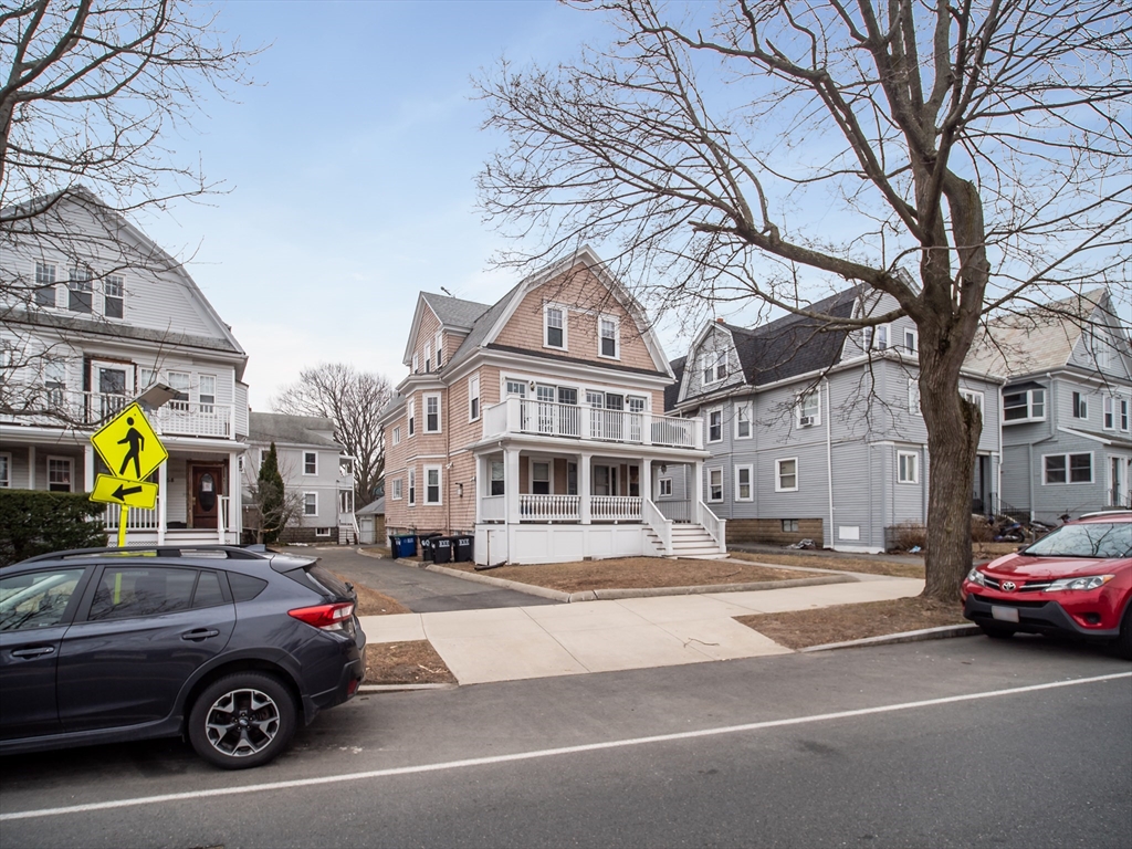 60 Powder House Boulevard, Unit 2 Somerville, MA 02144 - Photo 31 of 42 a car parked in front of a building