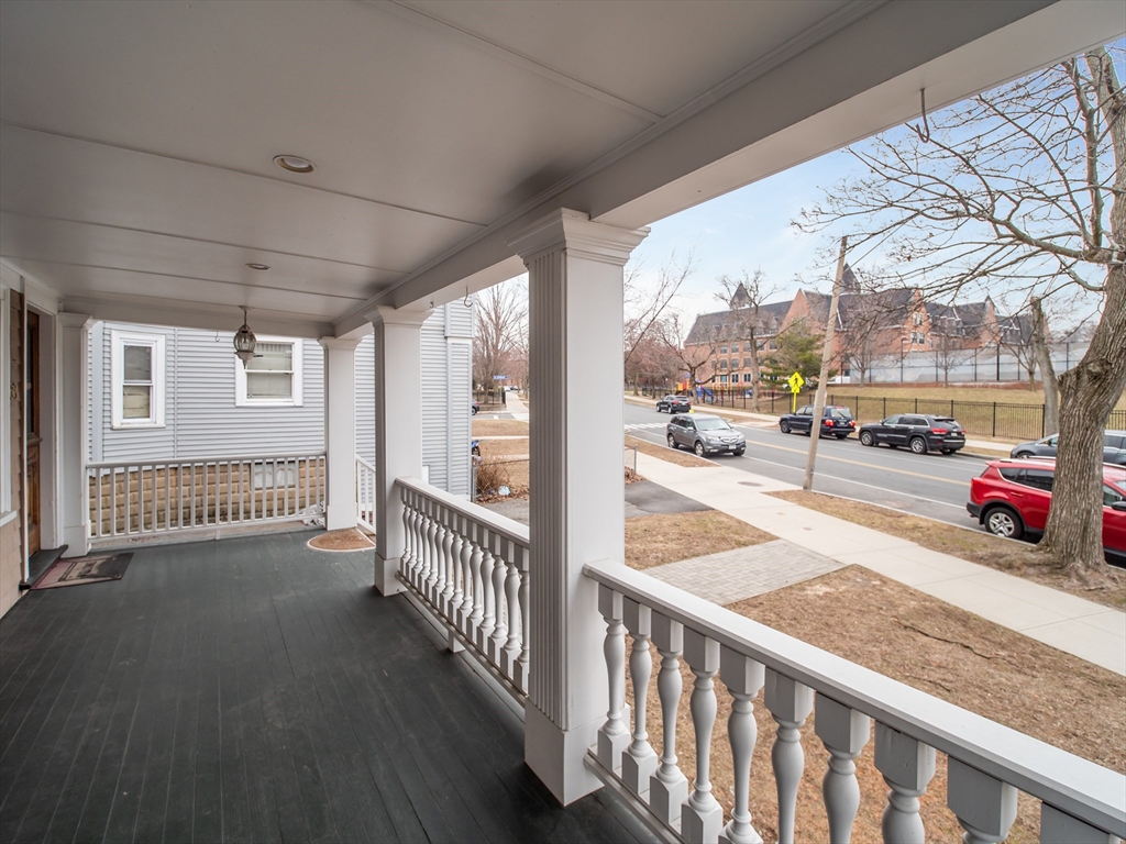 60 Powder House Boulevard, Unit 2 Somerville, MA 02144 - Photo 35 of 42 a view of a porch and car parked from balcony
