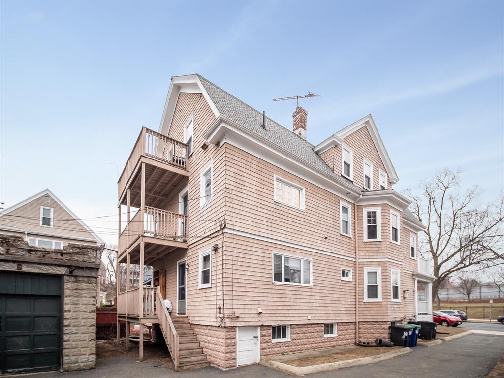 60 Powder House Boulevard, Unit 2 Somerville, MA 02144 - Photo 40 of 42 a view of a house with a street