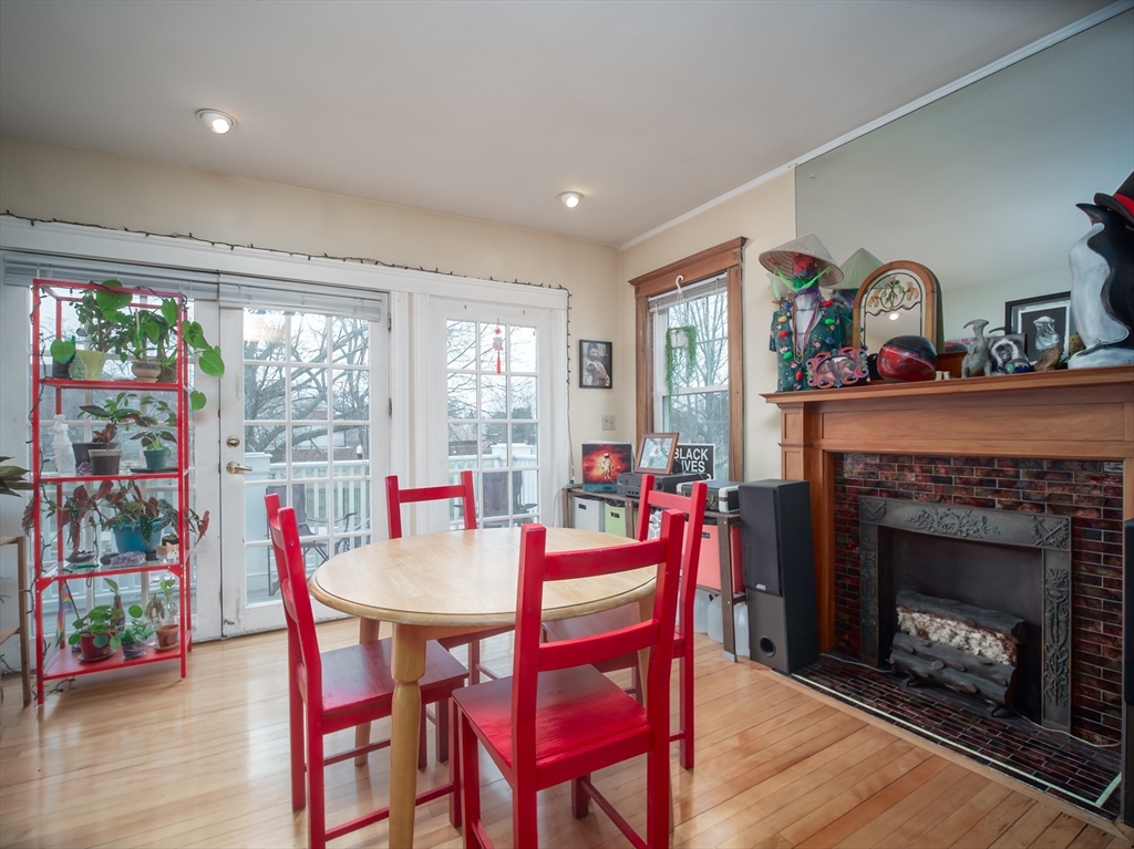 60 Powder House Boulevard, Unit 2 Somerville, MA 02144 - Photo 6 of 42 a view of a dining room with furniture window and outside view