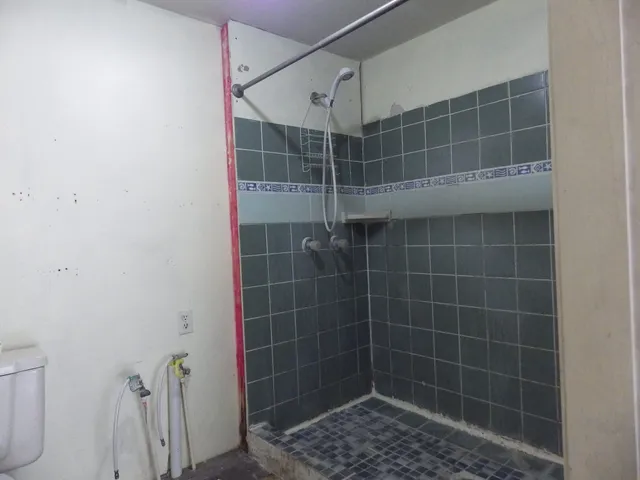 a kitchen with a stove a sink and a refrigerator