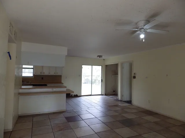 a kitchen with a sink cabinets and window