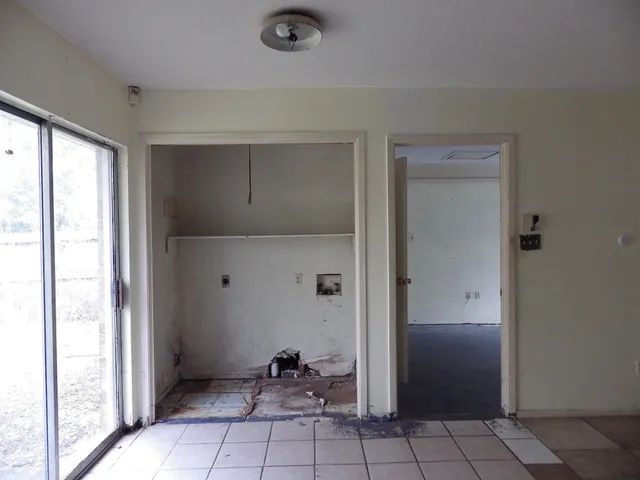 a kitchen that has a sink and a stove in it