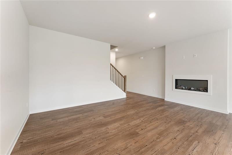1303 Farmers Loop Austell, GA 30106 - Photo 9 of 21 a view of an empty room with wooden floor