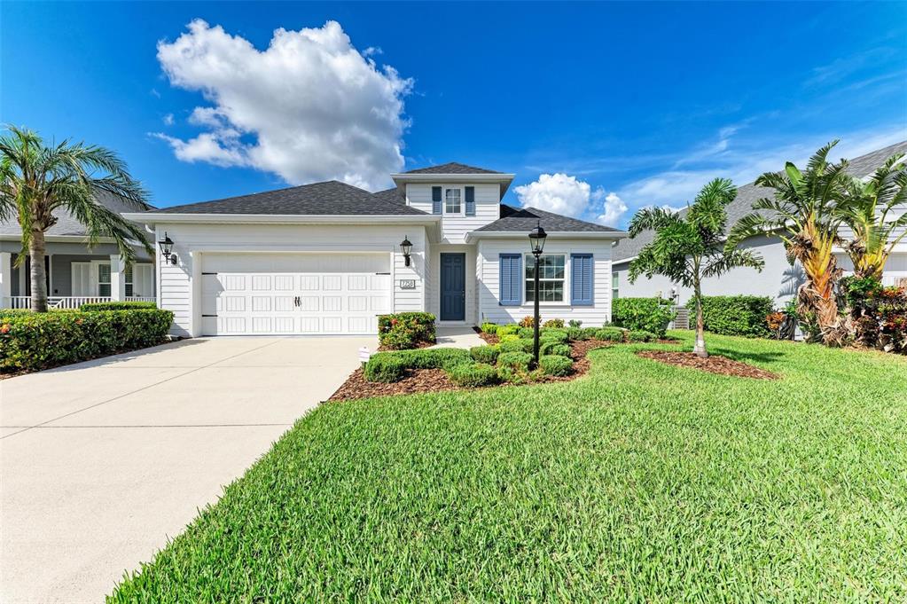 7758 Ridgelake Circle Bradenton, FL 34203 - Photo 1 of 1 a front view of a house with a yard