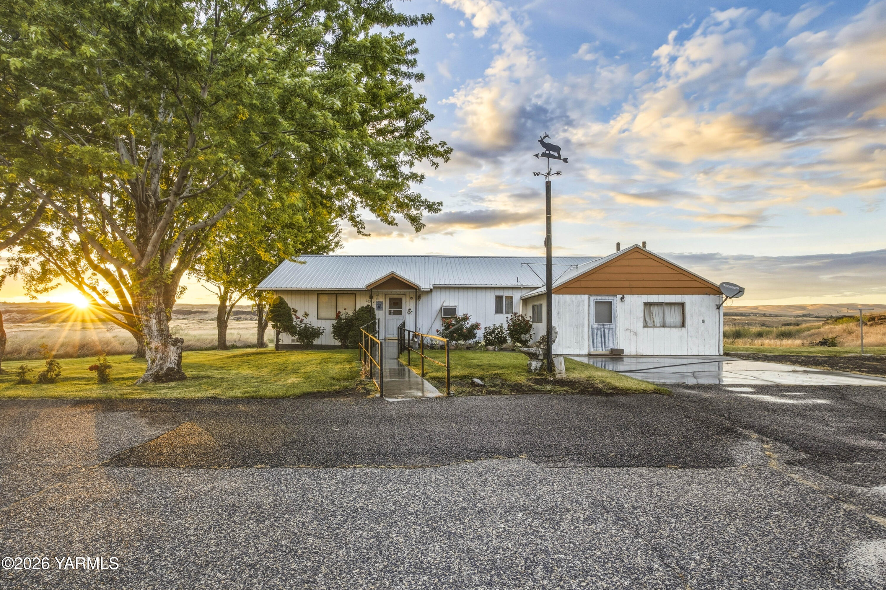 36322 D Mccall Road North Benton City, WA 99320 - Photo 23 of 39 a front view of a house with a yard