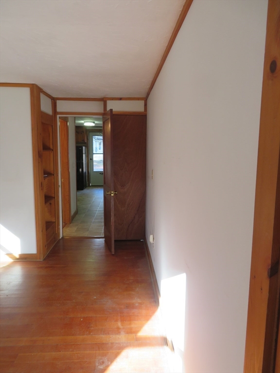103 King Philip Road Norton, MA 02766 - Photo 18 of 37 a view of a hallway with wooden floor