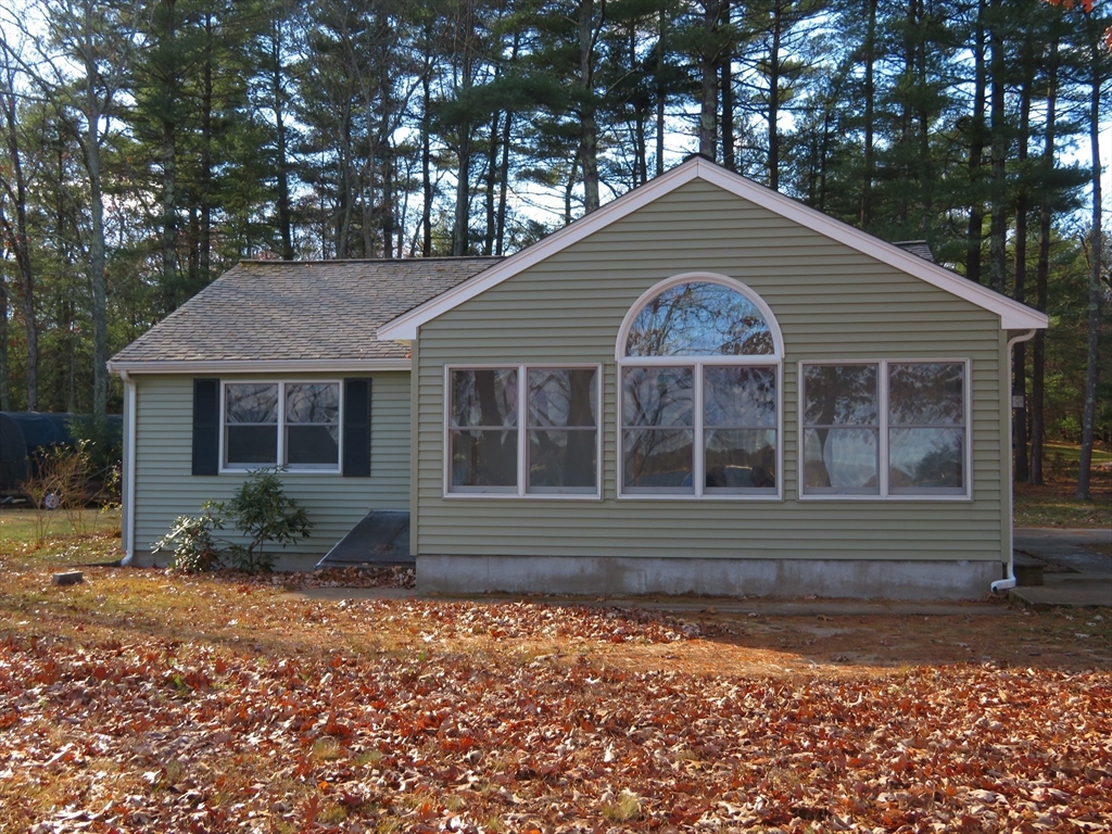 103 King Philip Road Norton, MA 02766 - Photo 2 of 37 a front view of a house with garden
