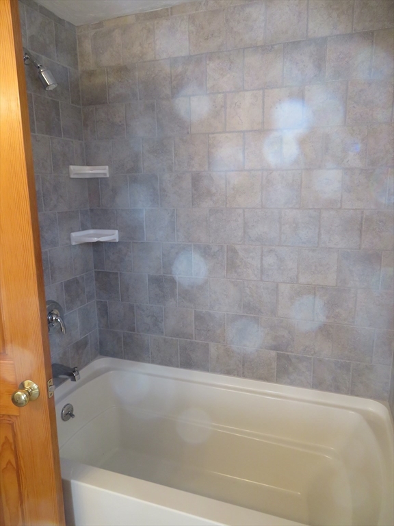 103 King Philip Road Norton, MA 02766 - Photo 21 of 37 a bathroom with a bathtub
