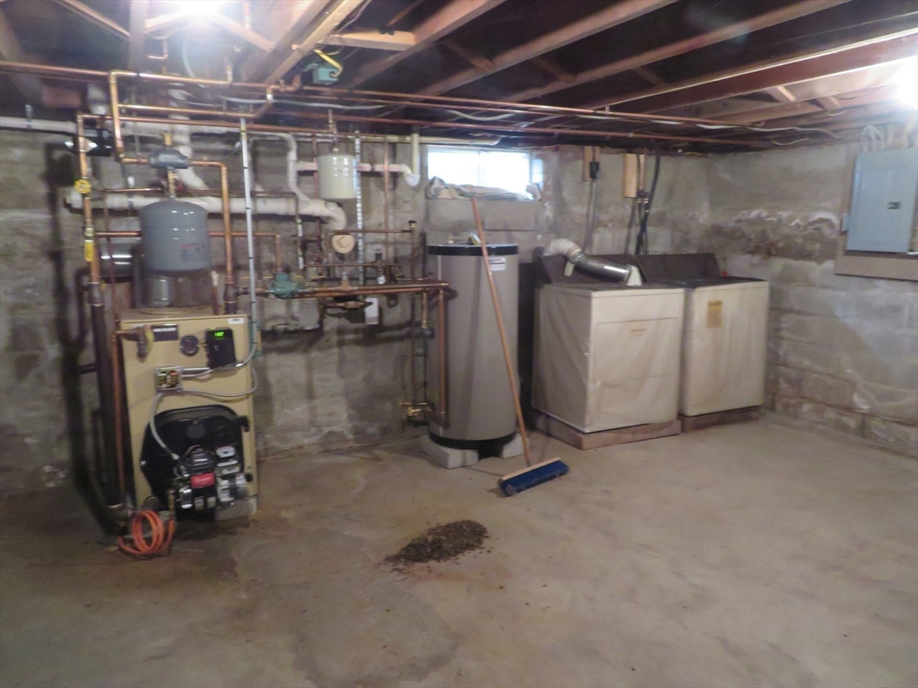 103 King Philip Road Norton, MA 02766 - Photo 25 of 37 a view of a storage room with washer and dryer
