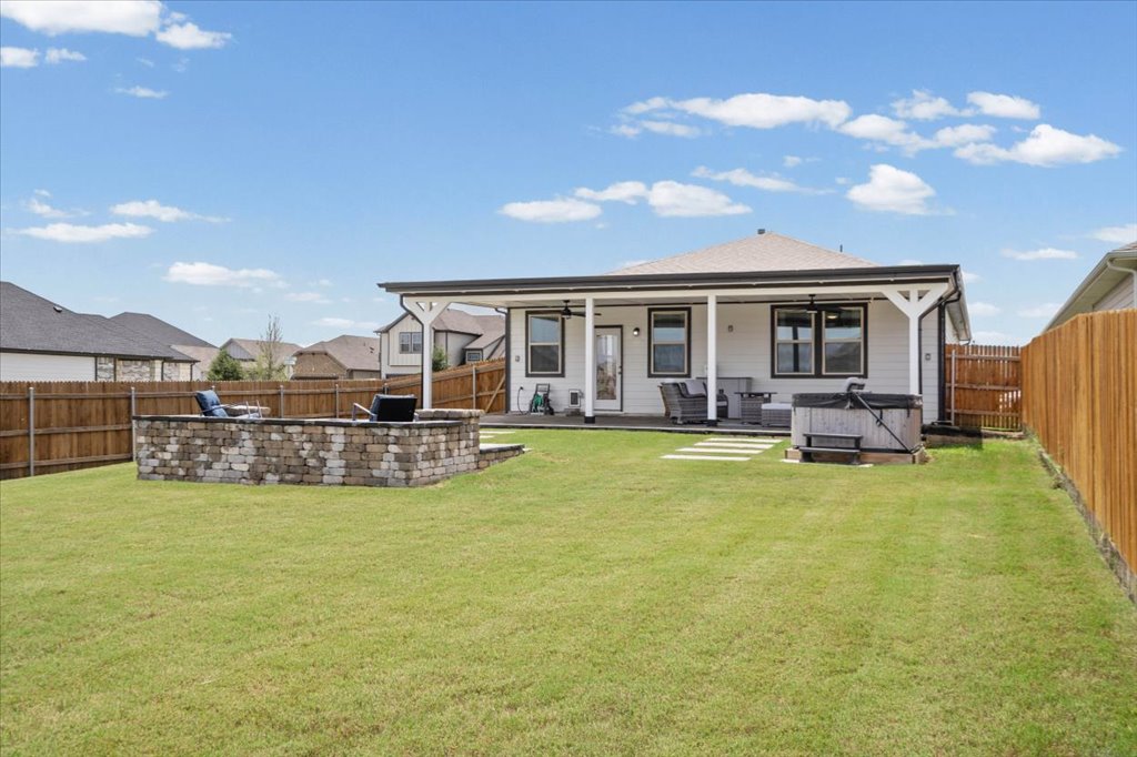 158 Gullivers Drive Elgin, TX 78621 - Photo 27 of 36 Look at how much green space you still have! Because this is a prime corner lot, the backyard is incredibly deep and wide.