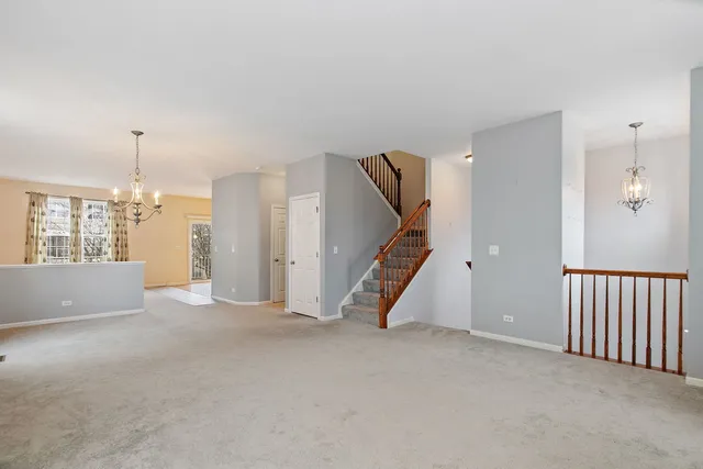 a view of an empty room with stairs