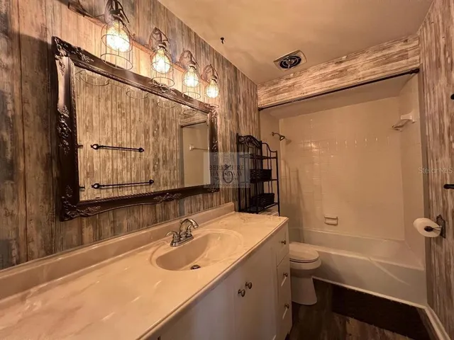 a view of a backyard with sitting area