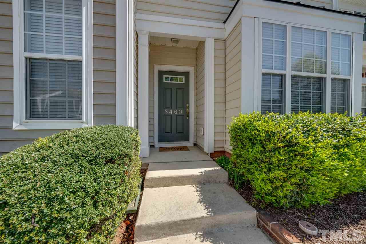 8460 Reedy Ridge Lane Raleigh, NC 27613 - Photo 2 of 22 a front view of a house with a yard