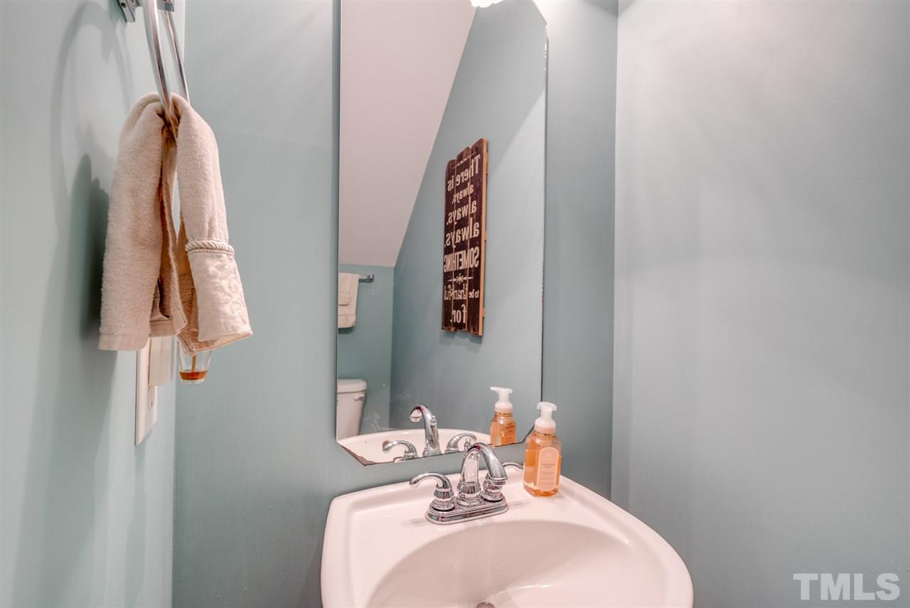 8460 Reedy Ridge Lane Raleigh, NC 27613 - Photo 12 of 22 a bathroom with a sink and a mirror