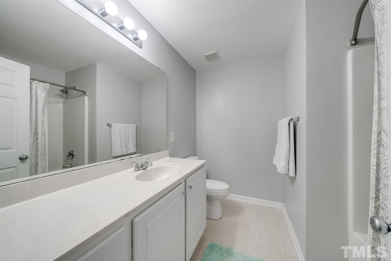 8460 Reedy Ridge Lane Raleigh, NC 27613 - Photo 15 of 22 a bathroom with a sink a toilet and shower