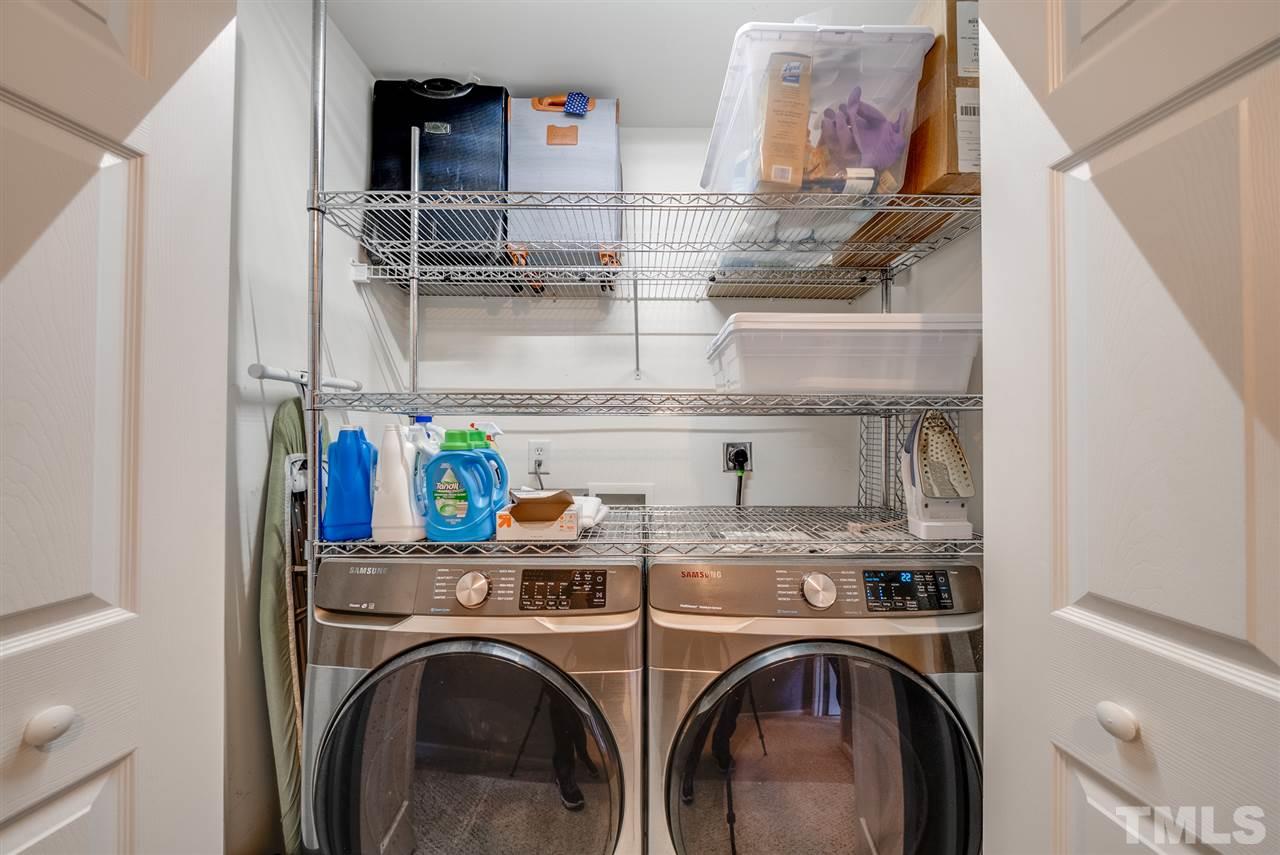 8460 Reedy Ridge Lane Raleigh, NC 27613 - Photo 16 of 22 a view of storage and utility room with washer and dryer