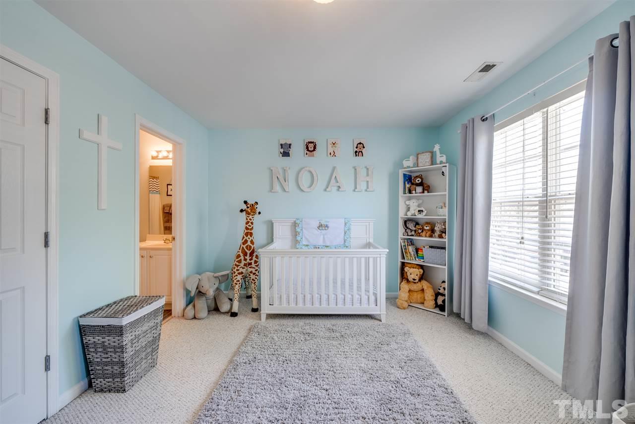 8460 Reedy Ridge Lane Raleigh, NC 27613 - Photo 18 of 22 a bedroom with furniture and a window