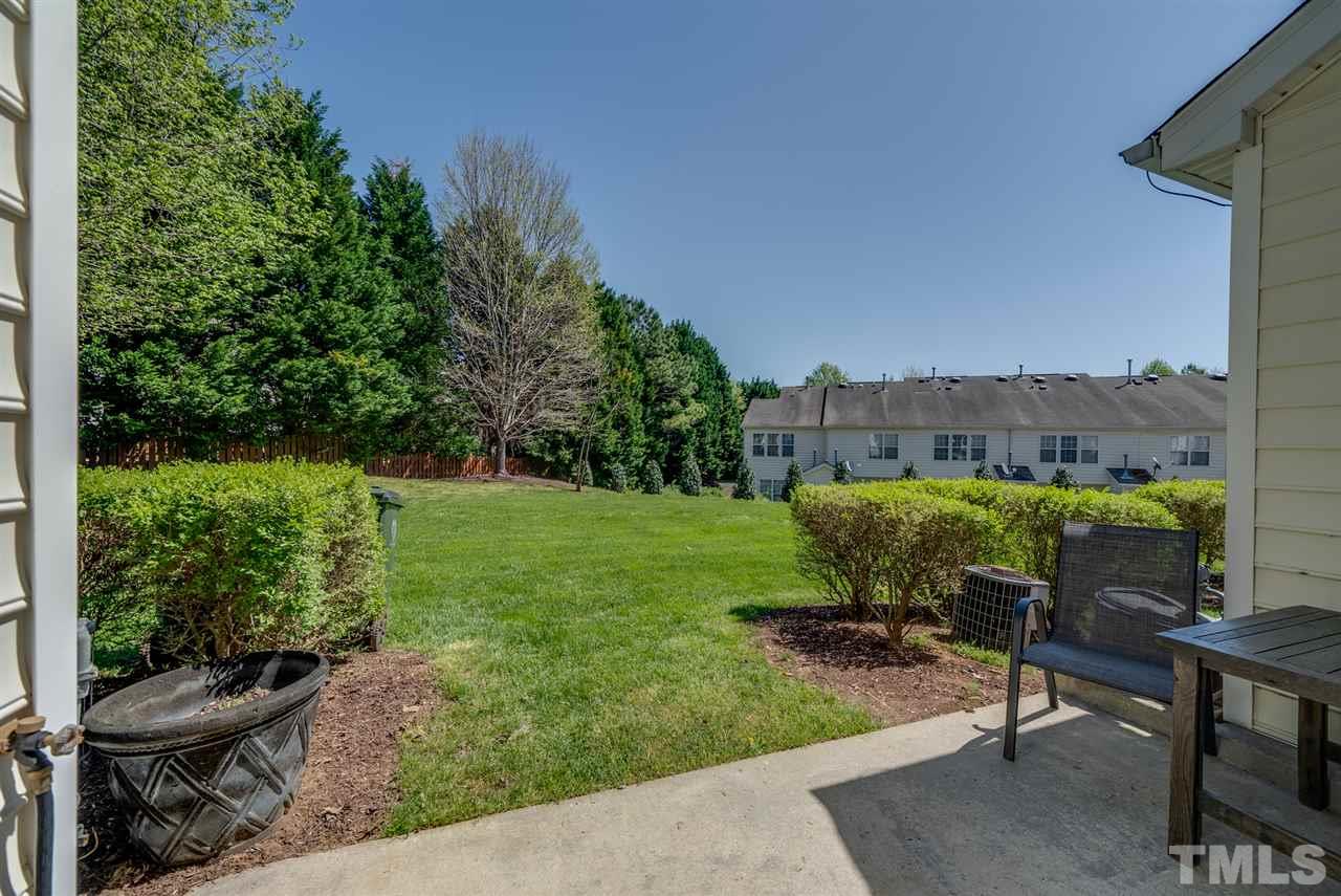 8460 Reedy Ridge Lane Raleigh, NC 27613 - Photo 21 of 22 a view of a chairs and table in backyard