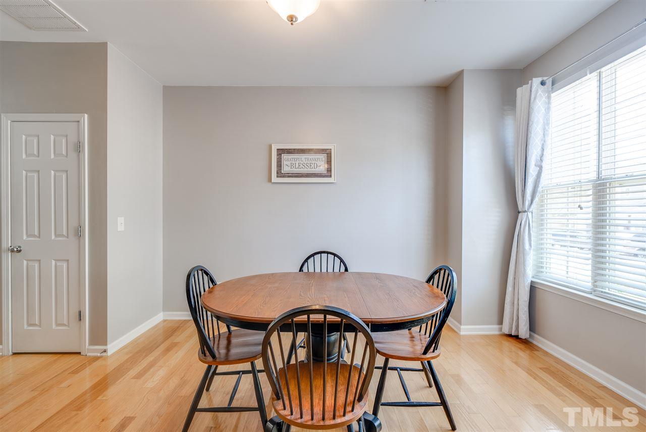8460 Reedy Ridge Lane Raleigh, NC 27613 - Photo 4 of 22 a view of a dining room with furniture window and wooden floor