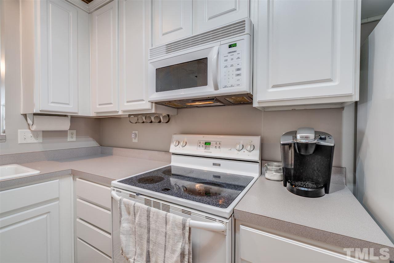 8460 Reedy Ridge Lane Raleigh, NC 27613 - Photo 6 of 22 a kitchen with a sink and cabinets