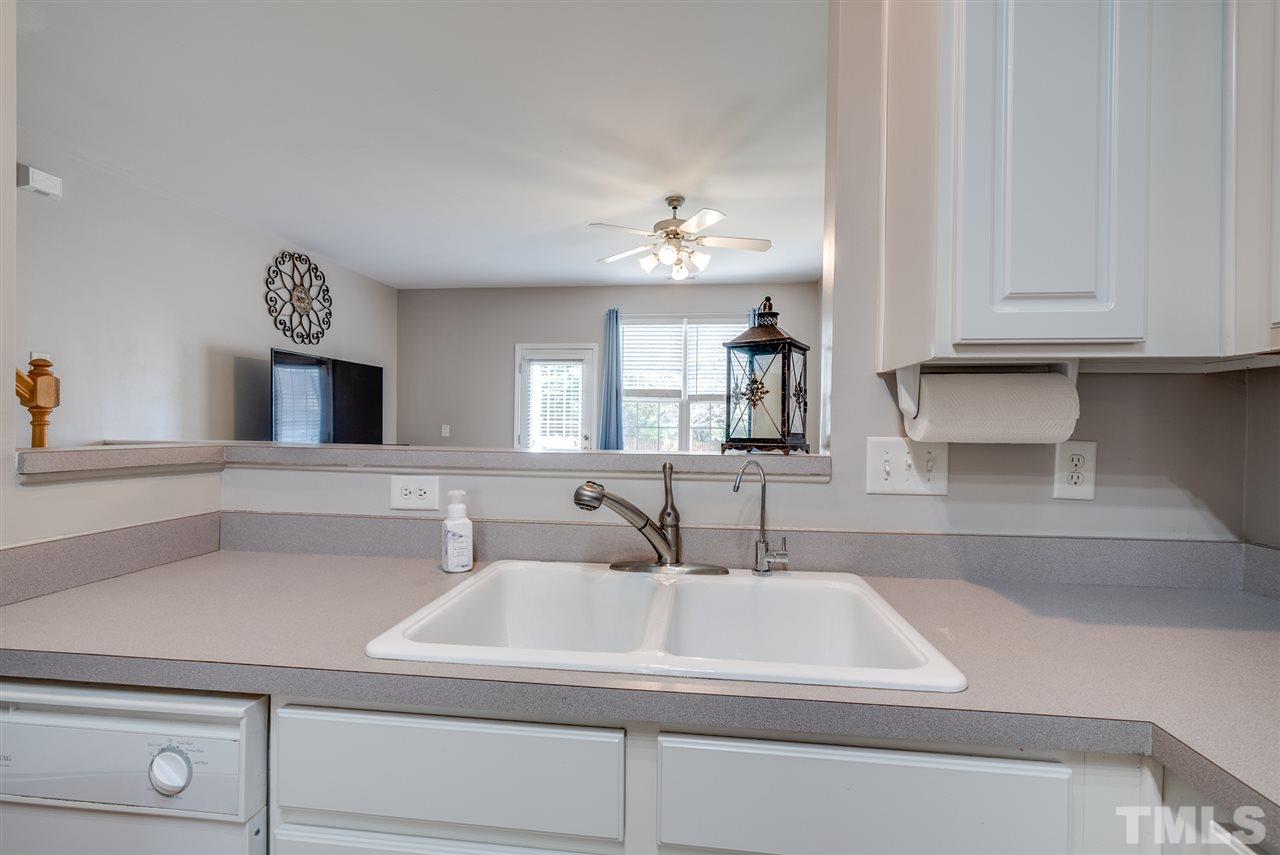 8460 Reedy Ridge Lane Raleigh, NC 27613 - Photo 7 of 22 a bathroom with a sink and a mirror