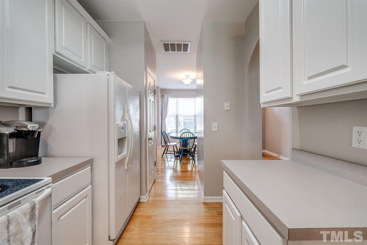 8460 Reedy Ridge Lane Raleigh, NC 27613 - Photo 8 of 22 a view of a kitchen from the hallway