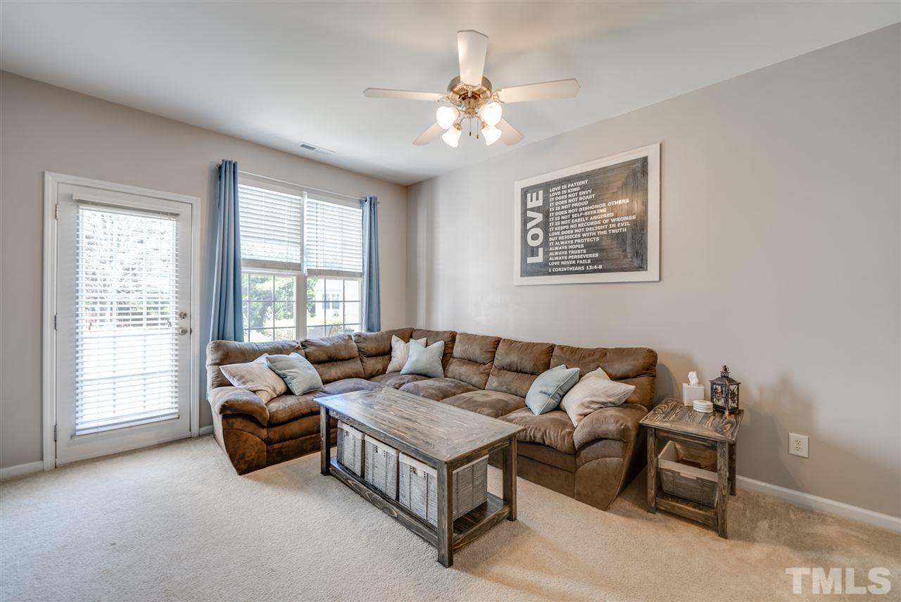 8460 Reedy Ridge Lane Raleigh, NC 27613 - Photo 9 of 22 a living room with furniture and a large window