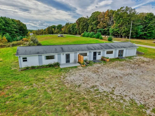 a aerial view of a house with garden