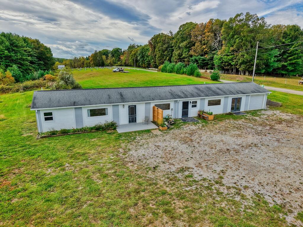 a aerial view of a house with garden