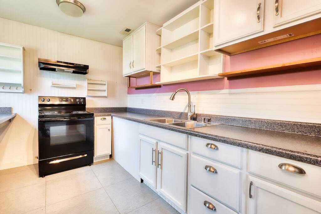 1011 Wilson Cemetery Road Northeast Check, VA 24072 - Photo 18 of 41 a kitchen with granite countertop white cabinets and white appliances