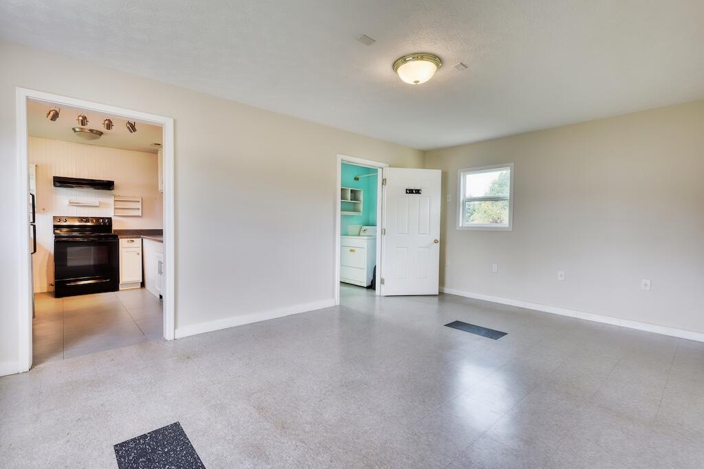 1011 Wilson Cemetery Road Northeast Check, VA 24072 - Photo 23 of 41 an empty room with windows and cabinet